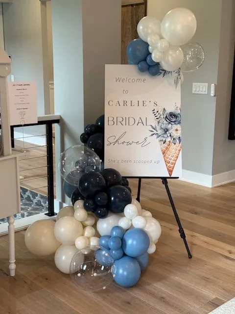Welcome sign garland in navy, dusty blue and white for a bridal shower