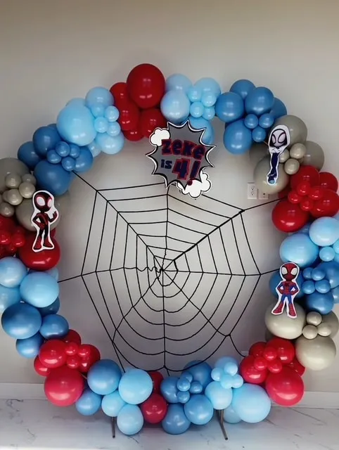 Round frame with a full garland in red, blue and gray for a superhero birthday